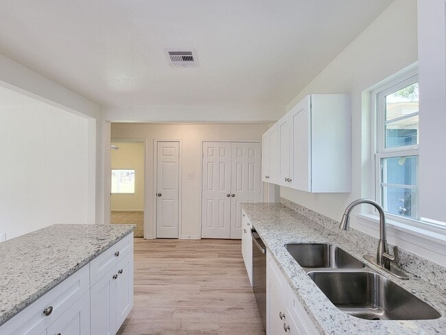 Building Photo - REMODELED 4 BEDROOM 2 BATH LEASE HOME IN A...