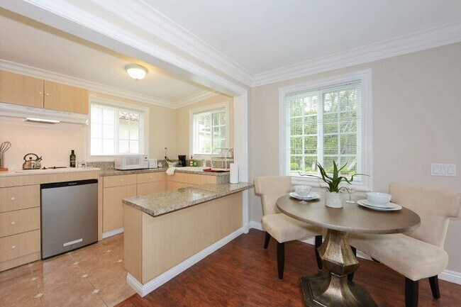 Building Photo - Welcome to this beautifully updated Spanis...