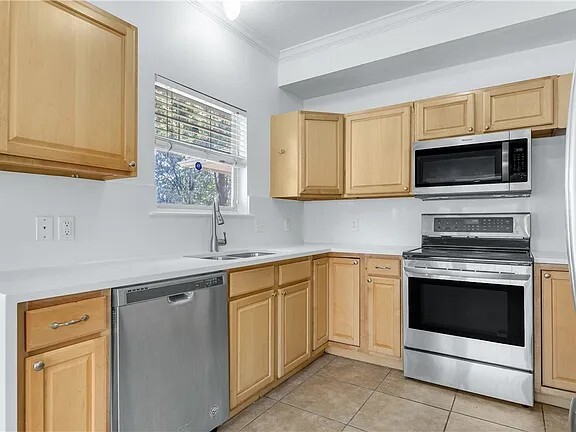 kitchen with quartz countertop with flowing river - 3811 Caleb Ct