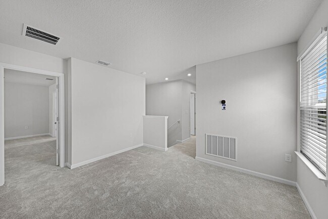 Building Photo - Brand-New 4BR Home with Tile Floors & Quar...