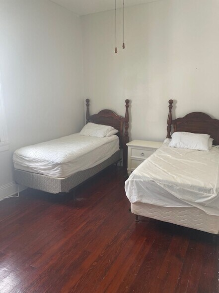 Smallest bedroom but still has room for desk, dresser and 2 twin beds. - 8226 Cohn St