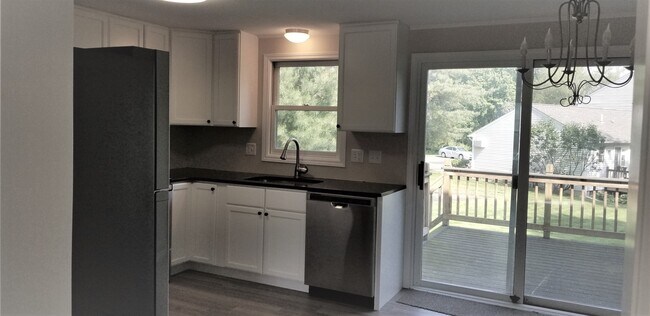 Bright kitchen with breakfast nook - 1 Maple St