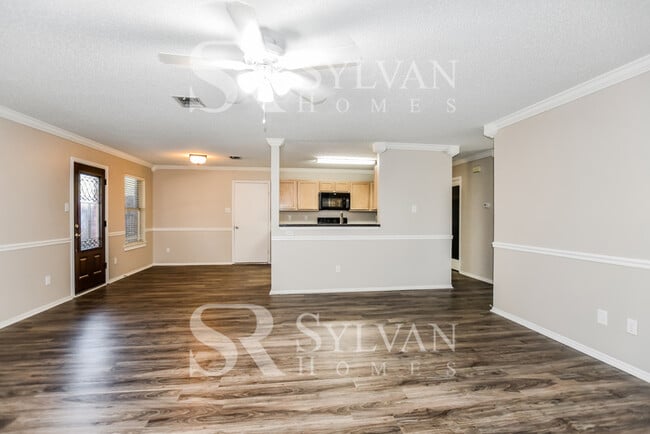 Building Photo - The living is easy in this gorgeous 4BR, 2.5BA brick home