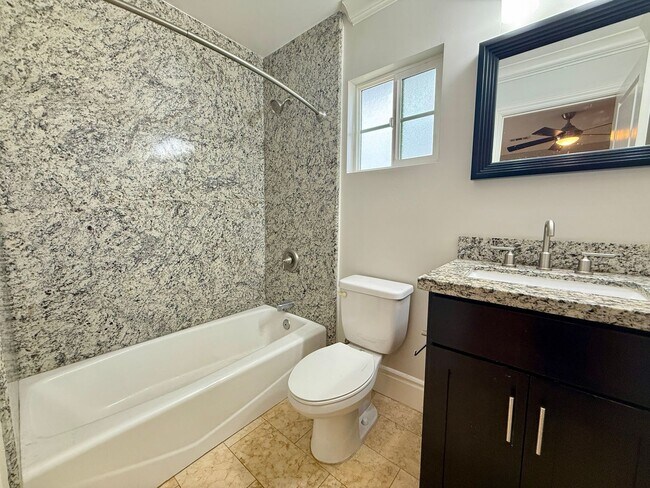 Building Photo - MOVE IN READY 2/2 with 2 Assigned Parking! In Unit Washer & Dryer! Gated Community! Centrally Loc...