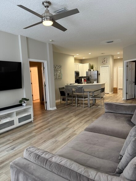 Living room overlooking dining area and kitchen - 9410 Georgian Park Ln
