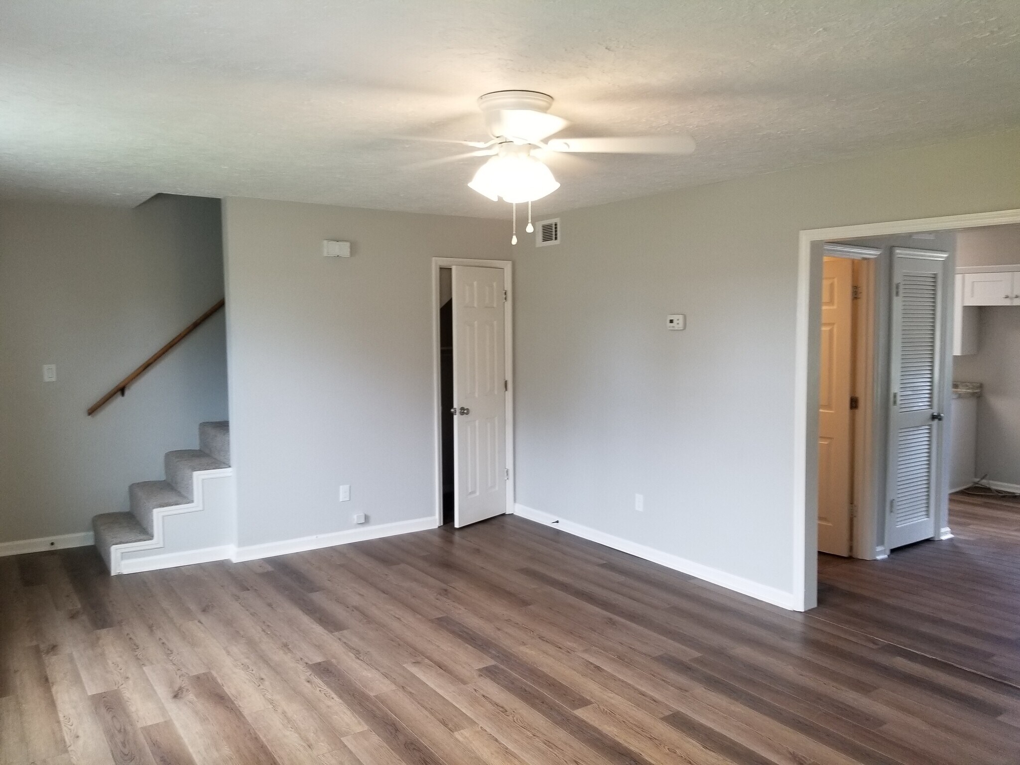 Living room. Looking towards dining on the right and front door far left. - 1445 Toshiba Drive, #B
