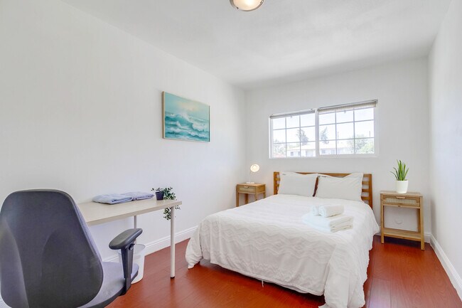 Bedroom 3 has a cloud-like queen bed & all the natural light you'll ever need. - 2304 E 14th St
