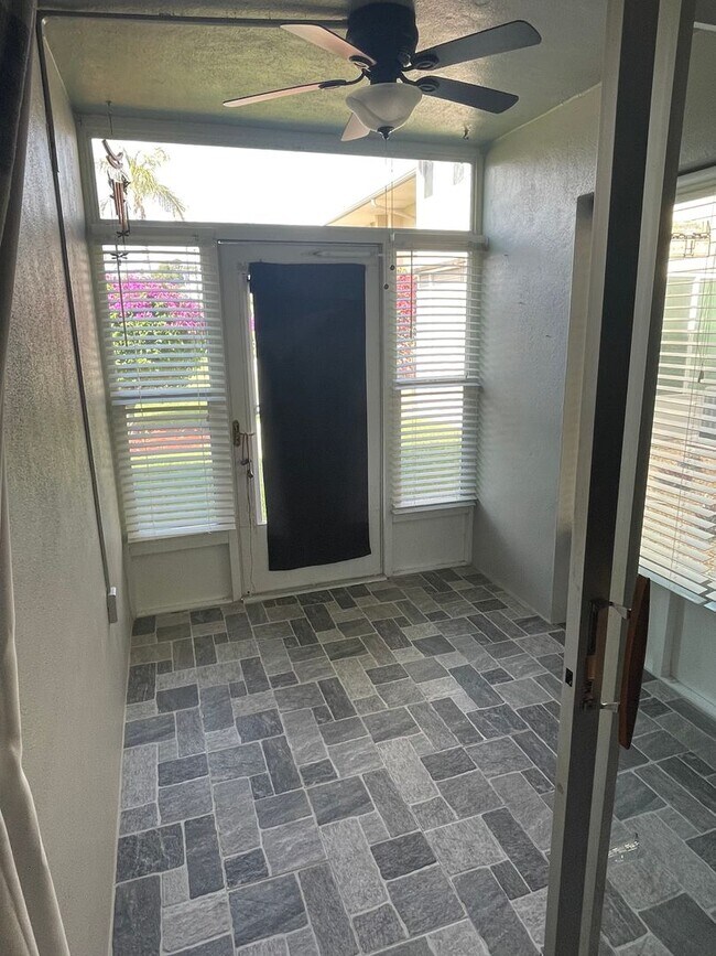 Building Photo - 55+ Charming first-floor condo nestled in ...