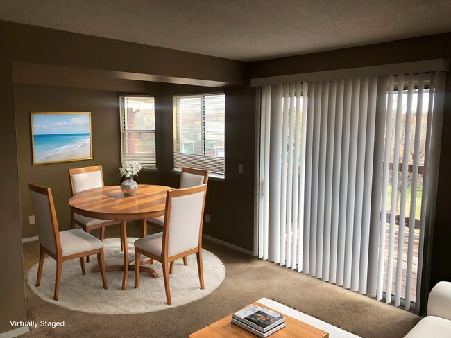 Building Photo - Top-floor Aurora Condominium with New Carpet
