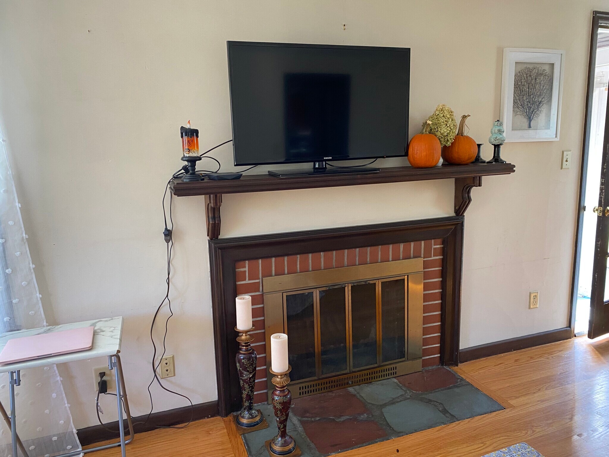 lliving room with fireplace and built in bookshelves - 384 Abbott St