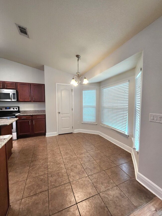 Building Photo - Welcome to your 4/2 dream home in Pace Mil...