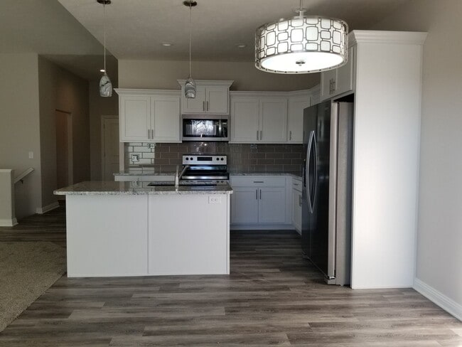 Building Photo - Daylight ranch townhome with 2 stall garage.  Private driveway and covered deck. high end finishe...