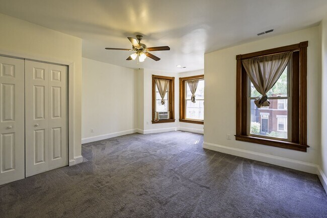 Building Photo - Historic & Charming 3BR Rowhouse near Howard is Move-in Ready!