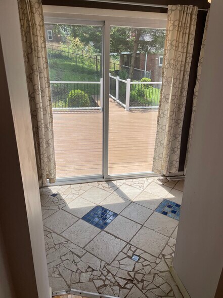 Mosaic tile in the sunroom - 227 Wilbert St