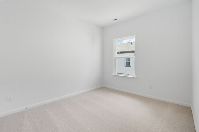 Building Photo - Brand-new three-story townhome in the Univ...