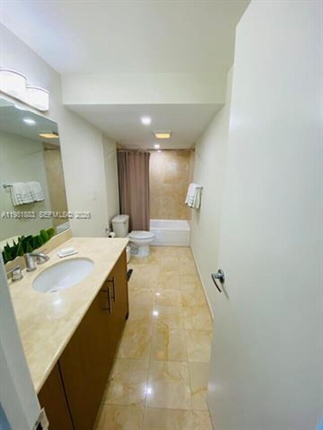 Building Photo - 10275 Collins Ave