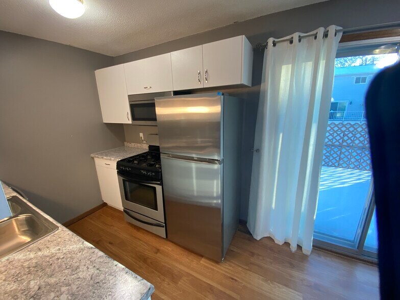 new kitchen with new cabinets and appliances - 6387 15th St N