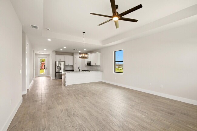Building Photo - New 3/2 Pool Home for Rent on Canal, Fenced Yard, Pets Welcome. Your Dog Approves of This Backyard