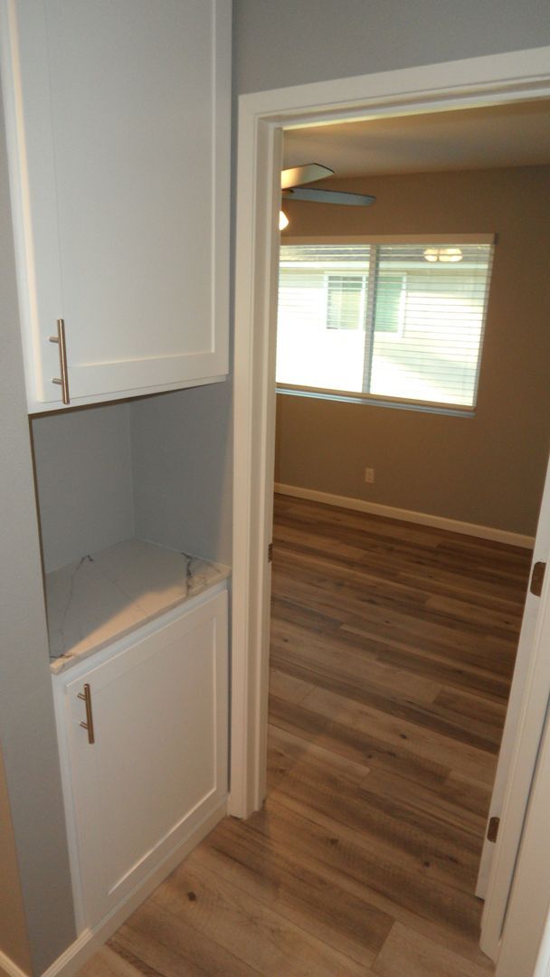 Building Photo - REMODELED 2BR; 1BA end unit condo w/ 1 car garage & 1 parking space