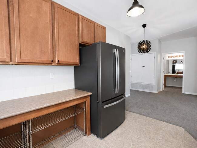 Building Photo - Spacious 2-Bedroom Condo with Garage, Fireplace, Pool & Most Included Utilities