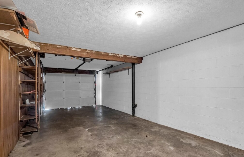 Oversized garage with shelving - 530 Whispering Hills Dr