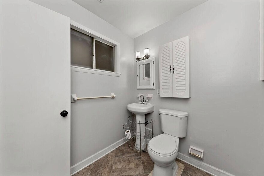 Half bath and laundry with washer / dryer hook up. - 11 Lawndale Ave