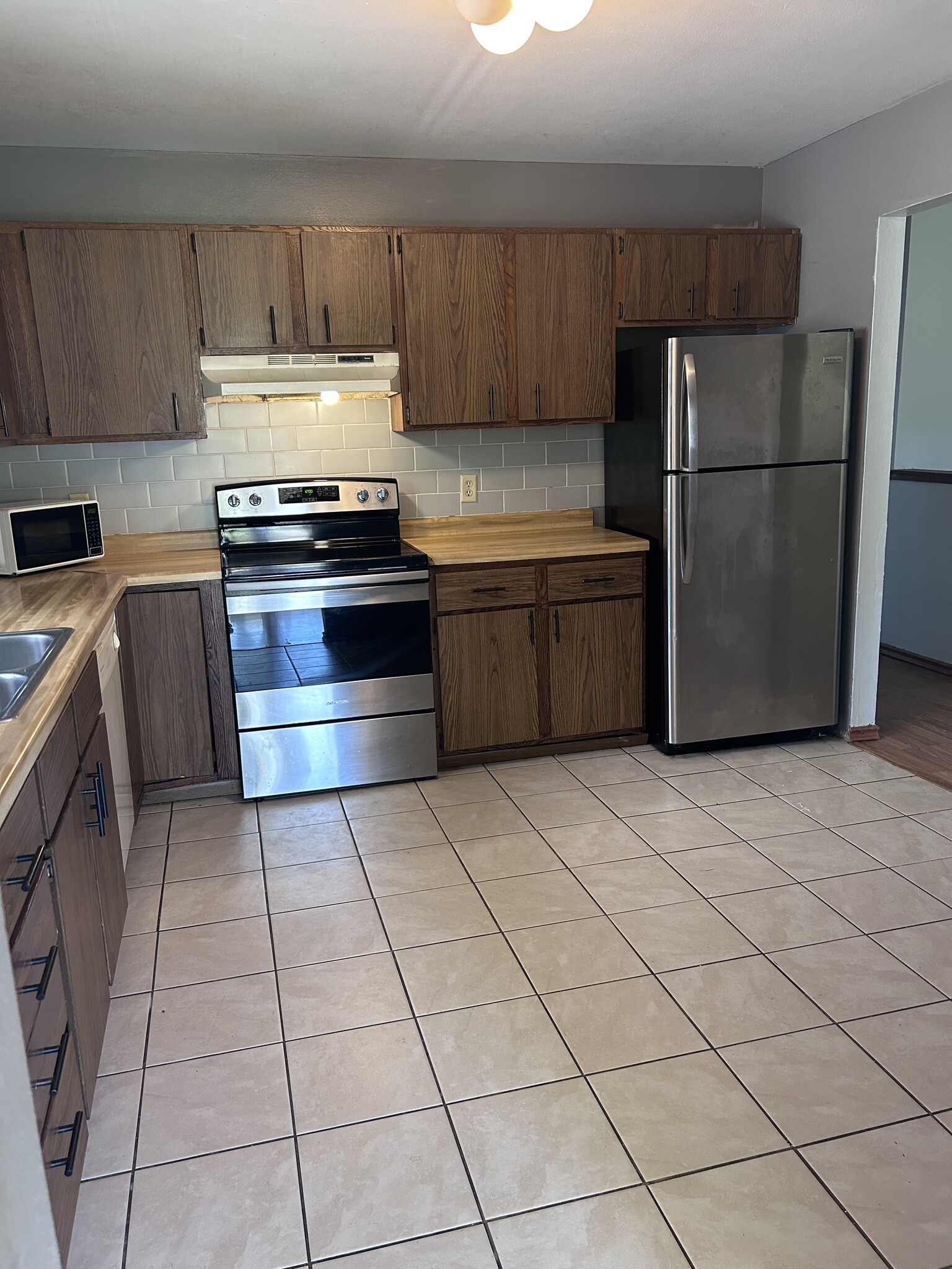 Kitchen with stainless steel appliances - 1230 S Thompson Dr