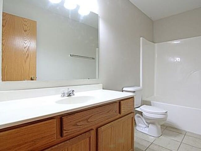 Building Photo - Great NE location -  4 bedroom 2.5 bath with attached 2 stall garage. Close to shopping & restaur...