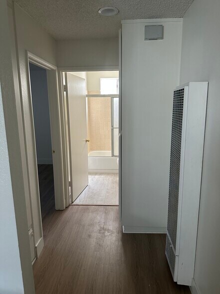 Hallway into bedroom and kitchen - 200 S Carondelet St