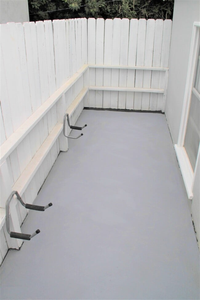 Gated deck with surf board holder - 3960 Haines St