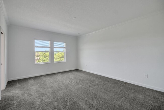 Building Photo - Stunning 4/3 in Gated Dora Parc! Water Views!