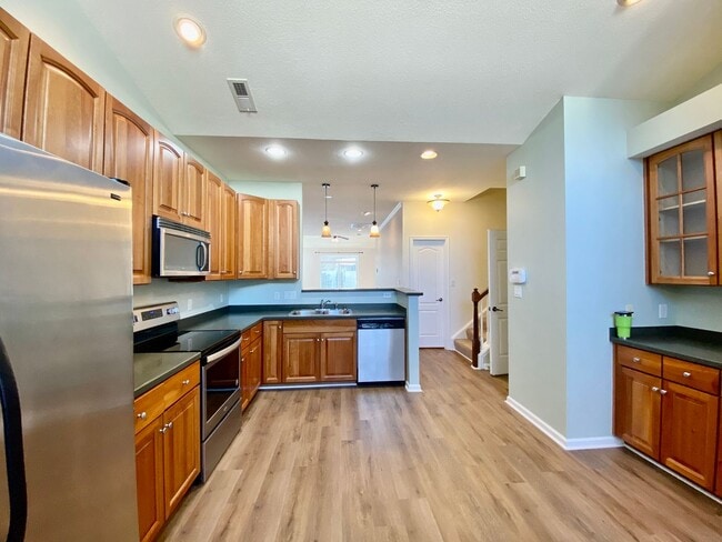 Building Photo - READY July 1st!! End-Unit Condo with Commu...