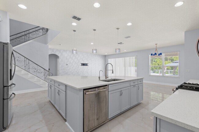 Building Photo - Spacious 6-Bedroom Home Near Lake Nona | 3-Car Garage + Tesla Charger