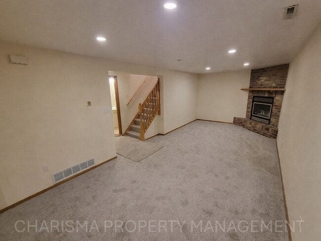 Building Photo - 4 BD, 2 BA - FENCED IN YARD, PRIVATE TRAILS, FINISHED UPPER AND LOWER LIVING AREAS, ATTACHED GARAGE!