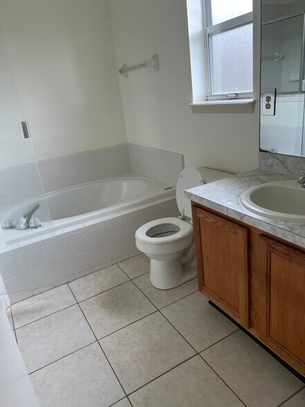 The master bath features a relaxing garden tub and dual sinks — perfect for a couple. - 5374 Lacy Jane Way