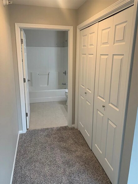 Huge double closet with hall to master bathroom. - 105 NW 8th St
