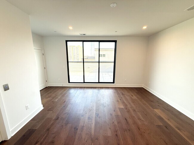 Building Photo - Brand new 4 level, 4 Bedroom Townhome with Elevator!