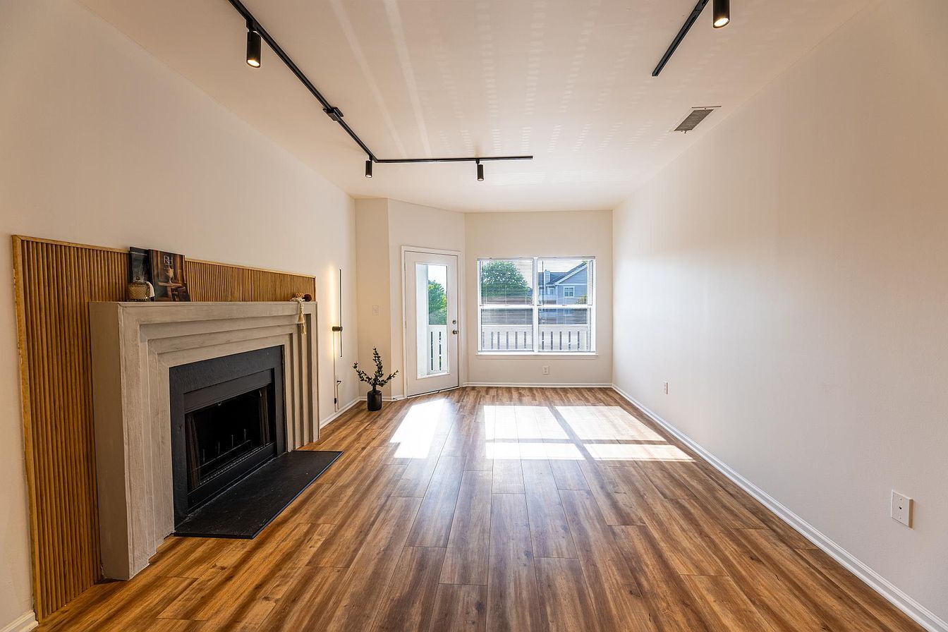 Living room with wood burning fireplace - 14301 Rosy Ln