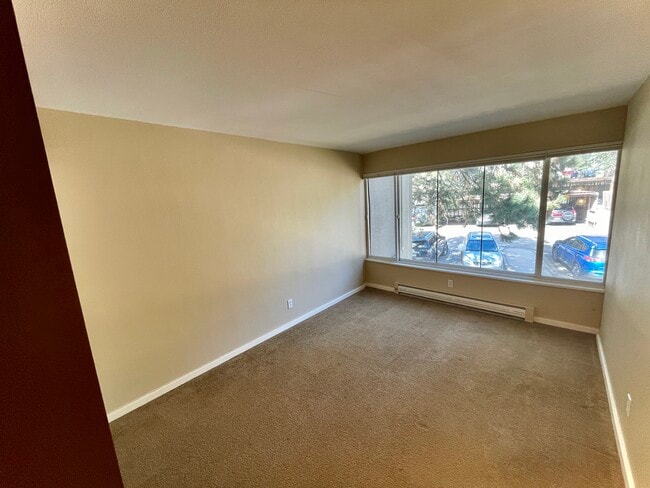 Bedroom/office brings in lots of natural light with its full-wall window - 2525 S Dayton Way
