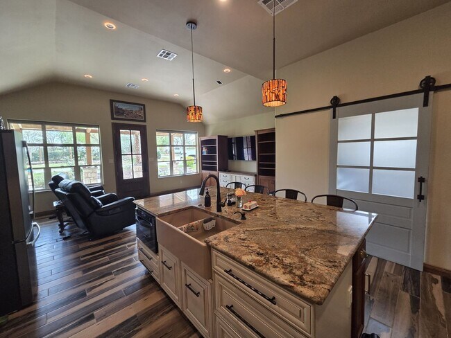 Building Photo - Custom built condo! Country Living! Offered unfurnished OR furnished!