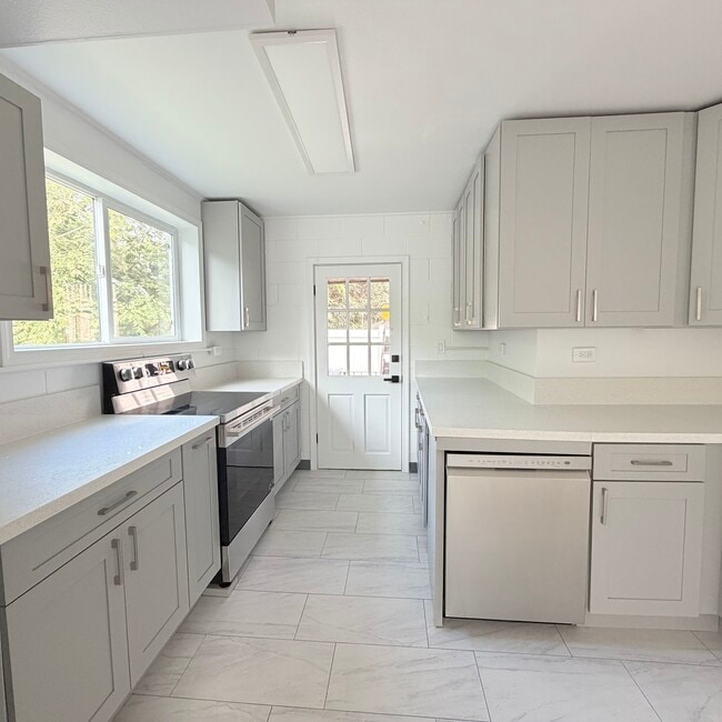 Brand new full size kitchen with all stainless steel appliances including dishwasher! - 1739 Kamohoalii St