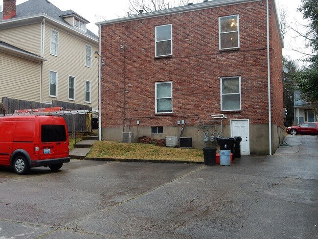 Off street parking area behind building. - 302 Crescent Ct