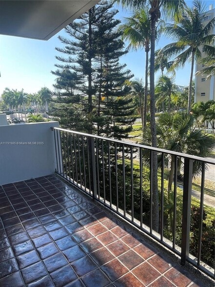 Open balcony with pleasant garden views - 575 Crandon Blvd