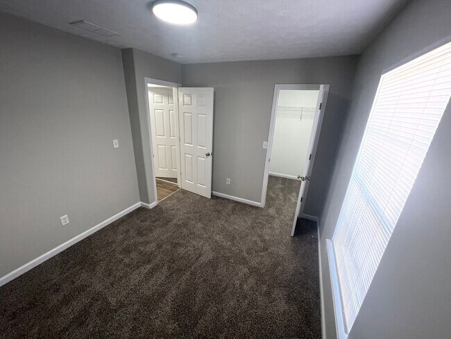 Building Photo - SUBLEASE - Three Bedroom Single Family Home with Fenced Backyard