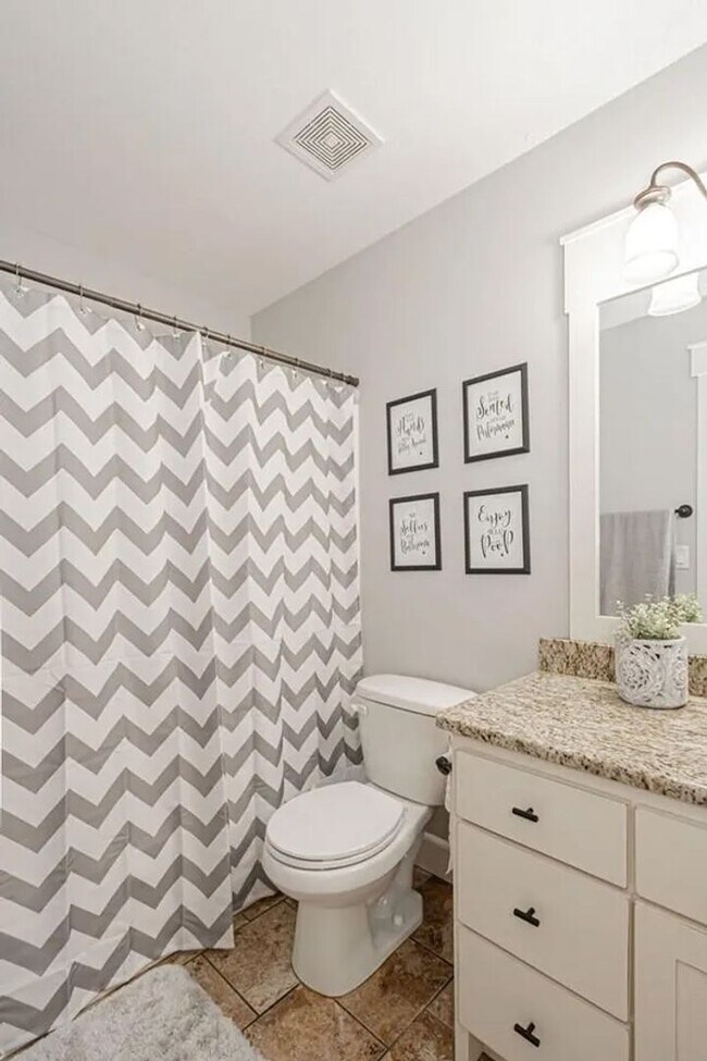 Building Photo - LOCATION, LOCATION, LOCATION - 4 Bedroom 3 Bath Home with TONS of storage. THIS PRICE INCLUDES TH...