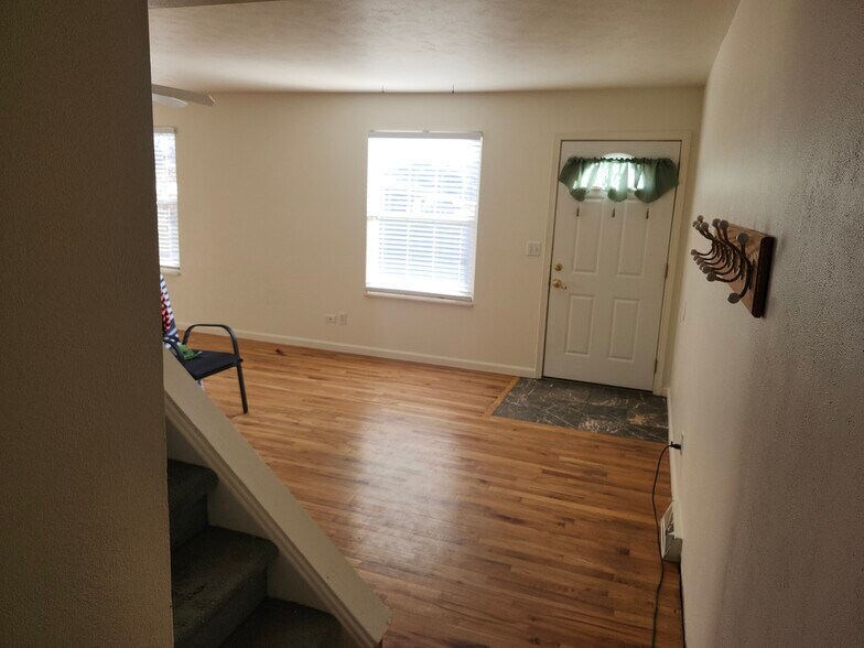 Front entry and stairs to bedrooms - 11461 W 107th Pl