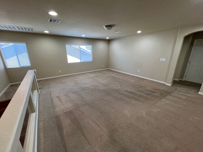 Building Photo - A Fantastic 4 Bedroom Home with the primary Downstairs, in Silverado Ranch