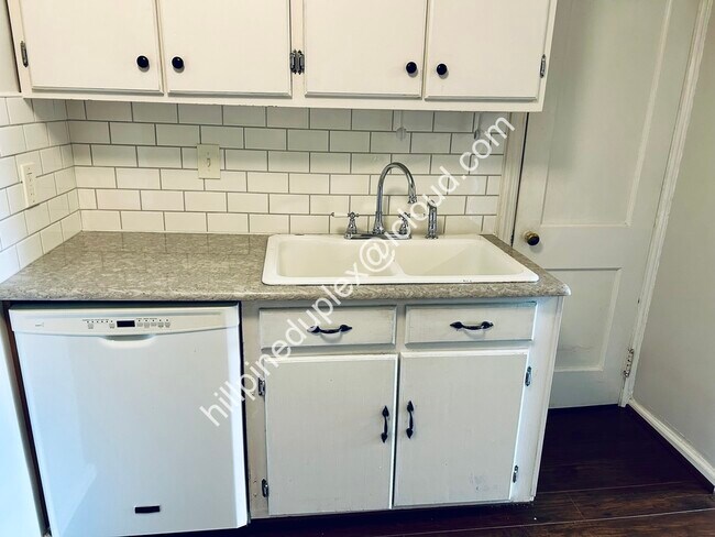 Spacious kitchen quartz counter tops with gas stove, built-in microwave, fridge, dishwasher, garbage - 629 Hillpine Dr NE