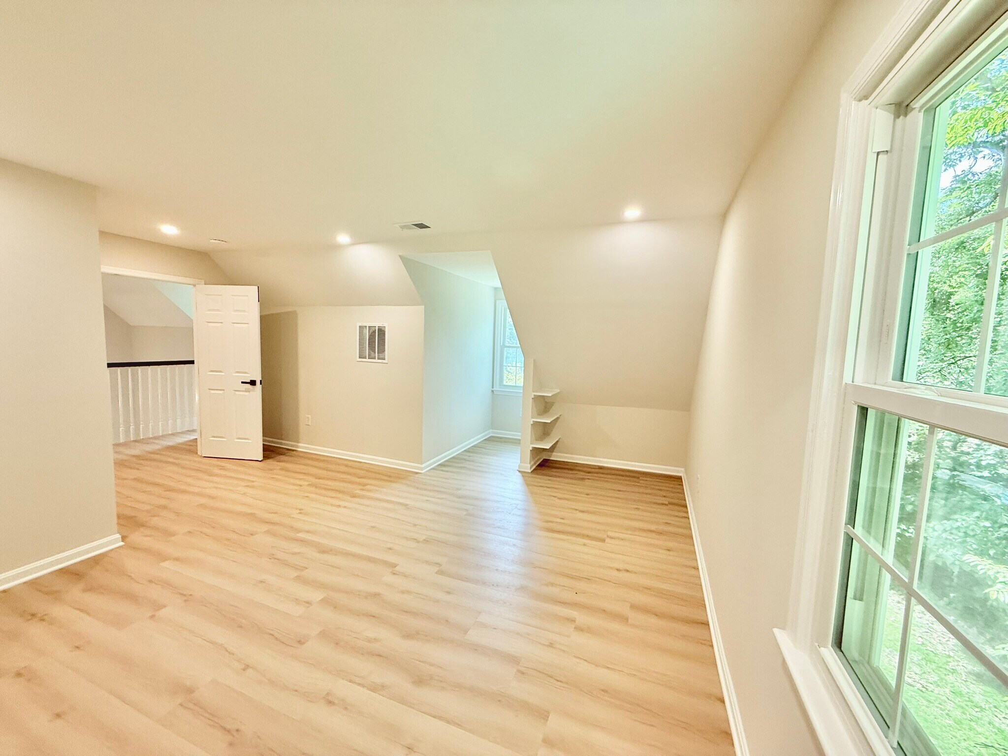 Upstairs primary bedroom 2 with natural light - 9248 Wood Glade Dr