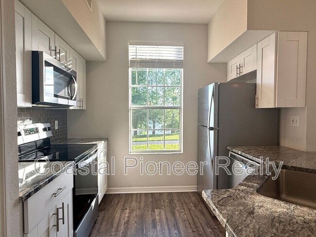 Building Photo - 9068 Lake Chase Island Way